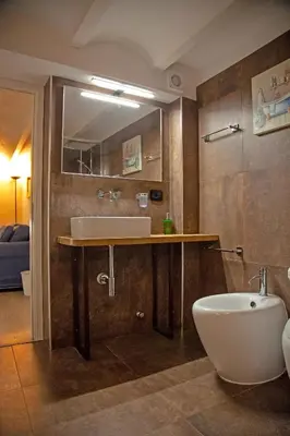 a bathroom with a sink and a bath tub at Palermo alla Gancia Room in Palermo