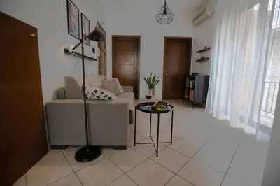 a living room with a couch and a table at Cassaro Casa Vacanze in Castellammare del Golfo