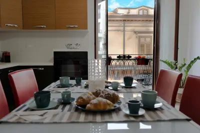 a table with a plate of food on top of it at Cassaro Casa Vacanze in Castellammare del Golfo