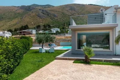 a villa with a view of a mountain at Nuova Villa a Scopello con piscina privata in Balata di Baida