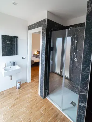 a bathroom with a shower and a sink at Civico64 apartments in Castellammare del Golfo