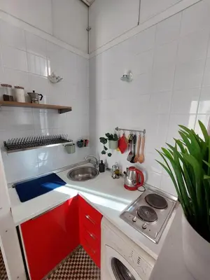 a kitchen with a sink and a washing machine at Lovely Apartment in the City Centre in Palermo