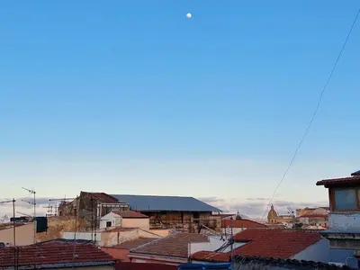 a view of roofs of buildings in a city at Lovely Apartment in the City Centre in Palermo