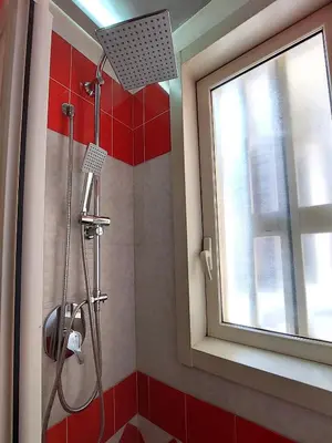 a shower in a bathroom with a window at Lovely Apartment in the City Centre in Palermo