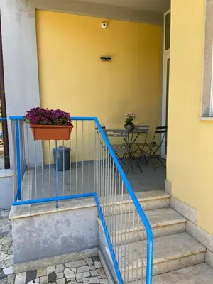 a stairway with a pot of flowers on a building at Villa Savoia Mondello in Mondello