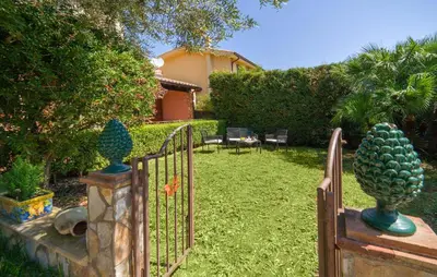 a gate with a fence with a pineapple on it at Beautiful Home In Torre Colonna-Sperone in Mandra Capreria