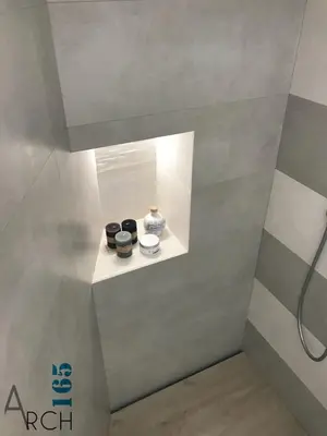 a shelf in a shower with two bowls on it at Le Camere dell’Emiro in Castronuovo di Sicilia