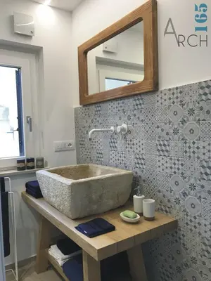 a bathroom with a sink and a mirror at Le Camere dell’Emiro in Castronuovo di Sicilia