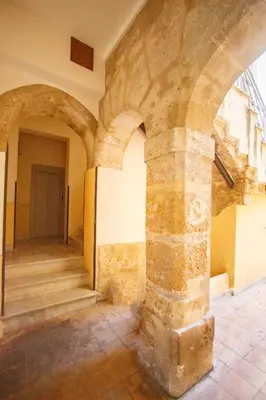 an empty room with a column in a building at A casa di Francy in Palermo