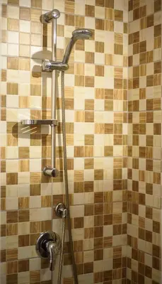 a shower with two faucets on a tiled wall at CENTRAL STATION APARTMENTS - Fanale Rentals in Palermo