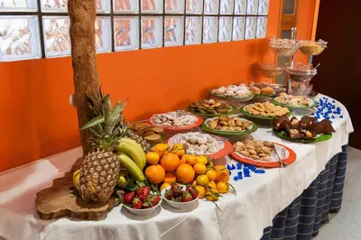 a table with a buffet of fruits and vegetables at Albergo Athenaeum in Palermo