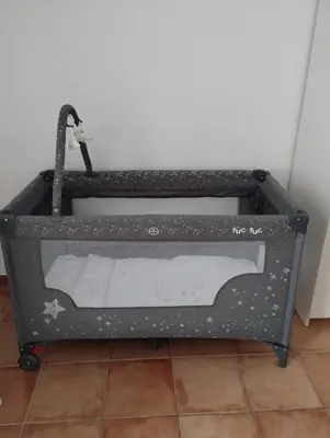 a gray tool box sitting on a tile floor at Casa vacanza Sole di Sicilia in Palermo