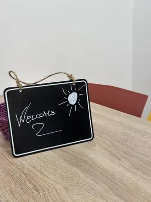 a sign sitting on top of a table at Cusciulìu House in Palermo