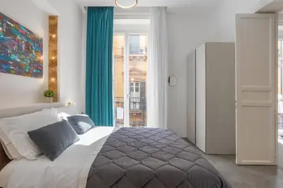 a bedroom with a bed and a large window at Mag 179 Bed & Spa in Palermo
