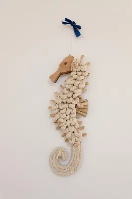 a seahorse made out of shells on a wall at Confortevole appartamentino in Castellammare del Golfo
