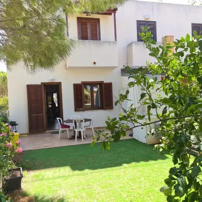 an external view of a house with a yard at CASA IL LIMONE 300M MARE PARK e GIARDINO PRIV WIFI in San Vito lo Capo