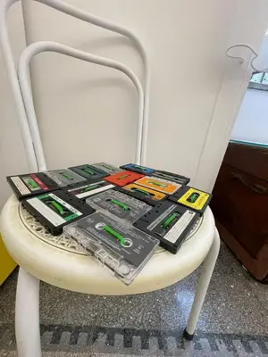 a white chair with a bunch of electronics on it at Tiski Toski Apartments Palermo in Palermo