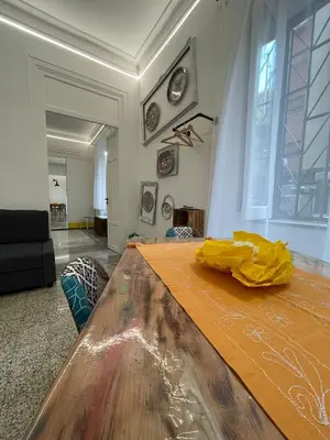 a large wooden table in a living room at Tiski Toski Apartments Palermo in Palermo