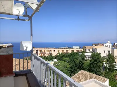 a balcony with a view of the ocean at La casetta a Scopello in Scopello