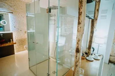 a bathroom with a shower with glass doors at Ambrosia-Timeless Hosting in Palermo