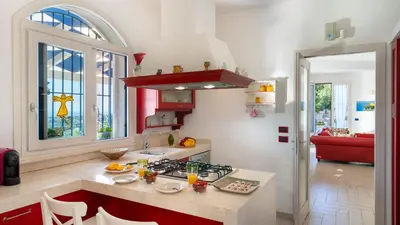a kitchen with a sink and a stove top oven at VILLA OLIMPIA 6&2, Emma Villas in Castellammare del Golfo