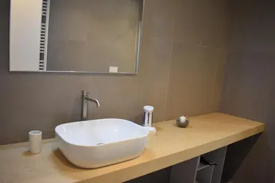 a bathroom with a white sink and a mirror at GiaChi friendly studios a Ballarò in Palermo