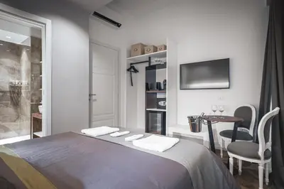 a bathroom with a shower and a toilet and a sink at Residenze Chamur- Grattacielo in Palermo