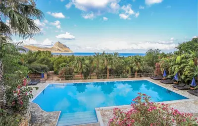a swimming pool with a view of the ocean at Pietro 4 in San Vito lo Capo