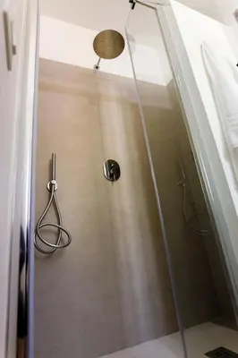 a shower with a glass door in a bathroom at TERRAVERA in Terrasini