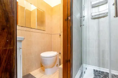 a bathroom with a toilet and a shower at GuestHost - Teatro Politeama and Teatro Massimo Cozy Apartment in Palermo