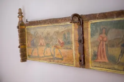 a painting on a wall with a picture on it at Kalbita home in Palermo