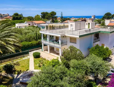 an aerial view of a white house with trees at Exclusive in Palermo