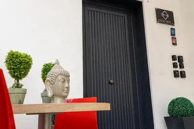 a statue of a head in front of a door at Exclusive in Palermo