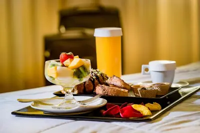 a tray of food on a table with a drink at Astoria Palace Hotel in Palermo