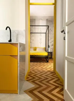a hallway with a yellow bed in a room at The347, Diletta in Palermo