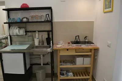 a small kitchen with a sink and a counter at atocà2 confortevole loft- vedi anche atocà1 in Palermo