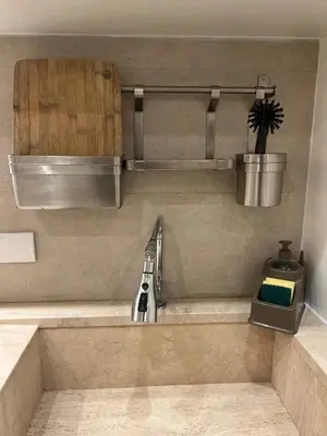 a kitchen counter with a sink and aventropheropheropheropheropheropherophe at Lux Apartment in Historical Center of Palermo in Palermo