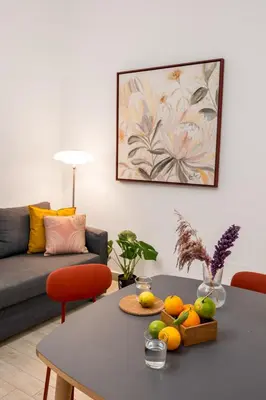 a living room with a table with fruit on it at Open Sicily Residence - Central Apartments Near Quattro Canti in Palermo