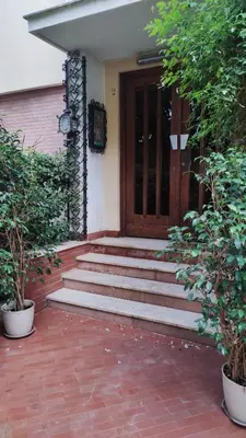 a set of stairs leading to a door of a house at Amunì rooms and suite LT in Palermo