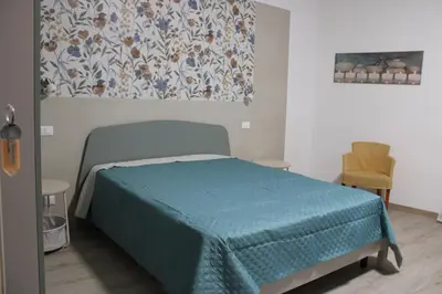 a living room with a television on a table at Terrazza Solemar -four rooms in Castellammare del Golfo