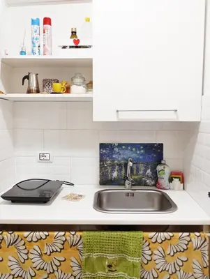 a kitchen counter with a sink and a stove at Palermo Centro - I Pastelli di Van Gogh in Palermo