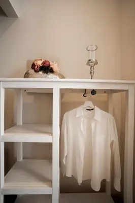 a white shelf with a white shirt on it at Borghi di Belmonte in Palermo