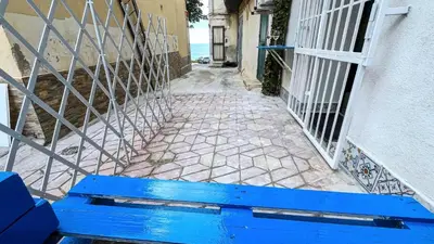 a bathroom with a tub and a toilet and a sink at Bleu bijou apartment in Palermo