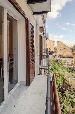 a balcony with a view of a building at Tarzanà 11 apartment - Cala di Palermo in Palermo