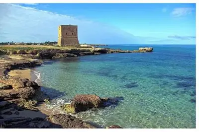 a tower in the middle of a body of water at Airport Home TUREI & BRINGO Car Rental in Cinisi