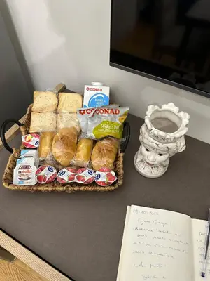 a tray of bread and other food on a table at Luxury Apartament's Celso- in Palermo