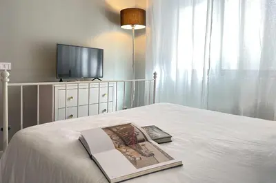a closet with a mirror and a chair at Vacanze al Mare by DomuSicily in Mondello