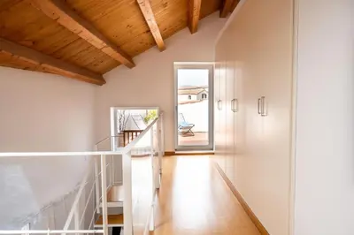 a dining room with a white table and chairs at Vittorio Emanuele apartment with terrace by Wonderful Italy in Palermo