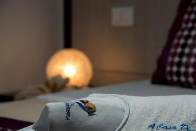 a towel on top of a bed with an american flag at B&B A casa di Aurora rooms in San Vito lo Capo