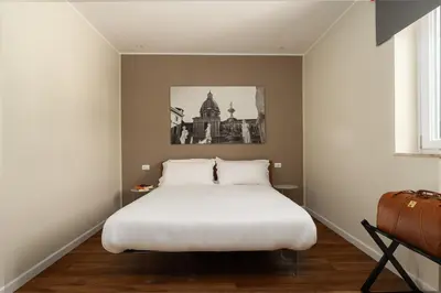 a bedroom with a large white bed in it at Attico 37 - Suite con terrazza privata e cucina in Palermo